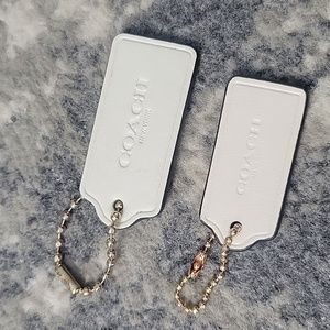 Two coach keys or purses holder